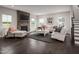 Gathering room with stone fireplace and comfortable seating area at 604 Mohinda Way, Willow Springs, NC 27592