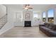 Spacious living room with fireplace and L-shaped couch at 79 Cascade Pl, Clayton, NC 27527