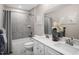 Modern bathroom with double vanity, bathtub, and shower at 8913 Stratus St, Willow Springs, NC 27592