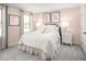 Charming bedroom with a white bed and decorative accents at 8913 Stratus St, Willow Springs, NC 27592