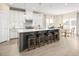 Modern kitchen with white cabinets, stainless steel appliances, and an island at 8913 Stratus St, Willow Springs, NC 27592