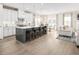 Modern kitchen with white cabinets, stainless steel appliances, and an island at 8913 Stratus St, Willow Springs, NC 27592