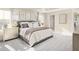 Spacious main bedroom with large bed and dresser at 8913 Stratus St, Willow Springs, NC 27592