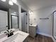 Modern bathroom with gray vanity and walk-in shower at 91 Calluna Dr, Clayton, NC 27520