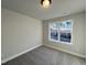 Bedroom with a view and neutral wall colors at 91 Calluna Dr, Clayton, NC 27520