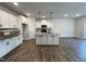 Open concept kitchen with granite countertops and island at 91 Calluna Dr, Clayton, NC 27520