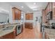 Modern kitchen with stainless steel appliances and granite countertops at 105 Gablewood Ln, Holly Springs, NC 27540