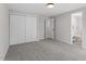 Spacious bedroom with gray carpeting, a large closet, and en-suite bathroom at 107 Crystal Ct, Cary, NC 27513