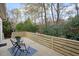 Relaxing deck with wood railings overlooking a wooded area at 113 Granby Ct, Cary, NC 27511