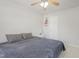 Bright bedroom featuring a king-size bed and ceiling fan at 122 Gatwick Ct, Clayton, NC 27520