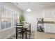 Bright eat-in kitchen with white cabinets and stainless steel appliances at 122 Gatwick Ct, Clayton, NC 27520