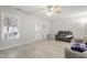 Living room with ceiling fan, fireplace, and hardwood floors at 122 Gatwick Ct, Clayton, NC 27520