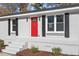 Front view of the house, red door, gray siding at 124 W College St, Oxford, NC 27565