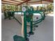 Green and beige outdoor fitness equipment under a covered pavilion at 129 Mayan Dr, Louisburg, NC 27549