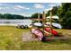 Outdoor kayak storage rack by the lake at 129 Mayan Dr, Louisburg, NC 27549