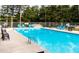 Inviting community pool with plenty of seating at 129 Mayan Dr, Louisburg, NC 27549