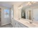 Main bathroom with double vanity, large mirror and a walk-in shower at 173 Finley Landing Parkway # 81, Smithfield, NC 27577