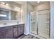 Bathroom with double vanity and large shower at 19 Covey Rise Way, Lillington, NC 27546