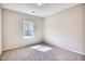 Bright bedroom with carpeted floor and large window at 19 Covey Rise Way, Lillington, NC 27546