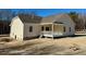 Back view of house showcasing a deck and backyard at 19 Covey Rise Way, Lillington, NC 27546