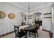 Bright dining room with a round table and open floor plan at 2077 Tordelo Pl, Apex, NC 27502