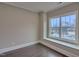 Bright bedroom with large window and dark hardwood floors at 222 Grand Griffon Way, Lillington, NC 27546