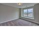 Well-lit bedroom with a window and carpet flooring at 222 Grand Griffon Way, Lillington, NC 27546