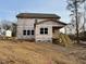 Two-story home with rear deck and stairs under construction at 222 Grand Griffon Way, Lillington, NC 27546