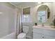 Bathroom with white tile, single vanity, and a tub/shower combo at 224 Cliffcreek Dr, Holly Springs, NC 27540