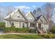 Front exterior of a two-story home with green siding and a covered porch at 224 Cliffcreek Dr, Holly Springs, NC 27540