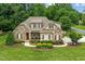 Two-story home with stone accents and landscaped yard at 2603 Churchill Dr, Burlington, NC 27215