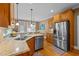 Kitchen features granite countertops, stainless steel appliances, and hardwood floors at 2603 Churchill Dr, Burlington, NC 27215