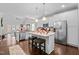 Spacious kitchen featuring stainless steel appliances and an island at 316 Spruce Pine Trl, Knightdale, NC 27545