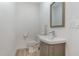 Simple, clean basement bathroom with a pedestal sink at 3319 Milton Rd, Raleigh, NC 27609