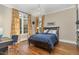 Well-lit bedroom with hardwood floors and double windows at 3319 Milton Rd, Raleigh, NC 27609