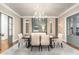 Elegant dining room features a chandelier and built-in cabinetry at 3319 Milton Rd, Raleigh, NC 27609