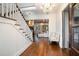 Bright and spacious entryway with hardwood floors and elegant staircase at 3319 Milton Rd, Raleigh, NC 27609