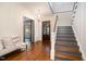 Elegant entryway, hardwood floors, chandelier, and staircase at 3319 Milton Rd, Raleigh, NC 27609
