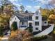 Stunning white brick home with gray roof and landscaped yard at 3319 Milton Rd, Raleigh, NC 27609