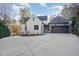 Attached garage with large driveway and basketball court at 3319 Milton Rd, Raleigh, NC 27609