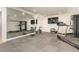 Well-equipped home gym with various exercise machines and mirror at 3319 Milton Rd, Raleigh, NC 27609