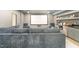 Finished basement home theater with large sectional sofa and wet bar at 3319 Milton Rd, Raleigh, NC 27609