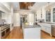 Spacious kitchen with center island and white cabinets at 3319 Milton Rd, Raleigh, NC 27609