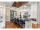 Modern kitchen with large island and stainless steel appliances at 3319 Milton Rd, Raleigh, NC 27609