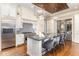 Gourmet kitchen features island, stainless steel appliances, and hardwood floors at 3319 Milton Rd, Raleigh, NC 27609