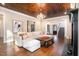 Living Room with hardwood floors, cozy sectional sofa, and wood beam ceiling at 3319 Milton Rd, Raleigh, NC 27609