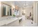 Luxurious bathroom with marble vanity, soaking tub, and walk-in shower at 3319 Milton Rd, Raleigh, NC 27609