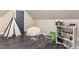 Fun playroom with teepee, beanbag chair, and toy storage at 3319 Milton Rd, Raleigh, NC 27609