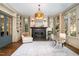 Bright study with fireplace, built-in shelves, and hardwood floors at 3319 Milton Rd, Raleigh, NC 27609