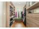 Large walk-in closet with ample shelving and drawers at 3319 Milton Rd, Raleigh, NC 27609